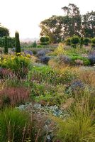 Mixed perennials and grasses within the walled garden at Broughton Grange
