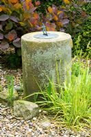 Sundial from Grandmother's garden with  variegated golden Foxtail grass - Hunmanby Grange, Yorkshire