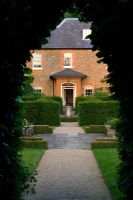 View through archway to The Old Rectory, Haselbech, Northamptonshire