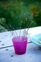 Burning lavender sticks for fragrance on wooden table