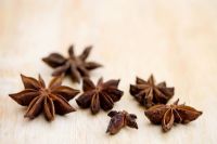 Star Anise on wooden chopping board