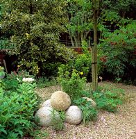 Large stone boulders set on gravel for texture, style and shape 