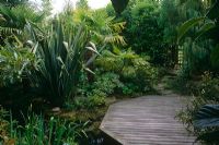 Large tropical garden with decked platform - The Hockett, Marlow, UK