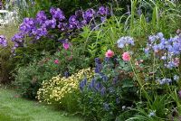 Herbaceous border with Phlox, Agapanthus, Rosa, Cistus and Veronica in 'Celebrating Cheshire's Year of Gardens' designed by Chris Beardshaw, Tatton Flower Show 2008