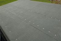 Finished roof - new felt with overlapped strips nailed on to adhesive bed