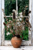 Rustic dried flower arrangement with Lunaria, Papaver and Dipsacus fullonum - Honesty, Poppies and Teasels