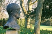 'Im Memoriam III' 1983, bronze head on plinth by Dame Elizabeth Frink - Cranborne Manor Garden, Cranborne, Dorset