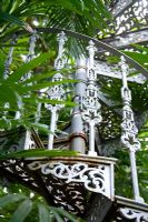 Metal spiral staircase in glasshouse