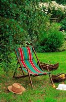 Striped deckchair in summer garden
