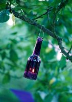 Tree lights made from old bottles and jars