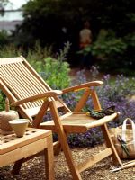Wooden chair and table in garden