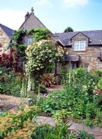 Cottage garden with mixed flowerbeds