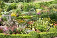 Summer flower borders at Little Larford Cottage in Worcestershire