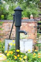 Old fashioned water pump in the garden at Dial Park, Worcestershire.