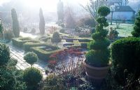 Frosty knot garden with topiary and Sedum spectabile flowerheads - Woodpeckers, Warwickshire NGS