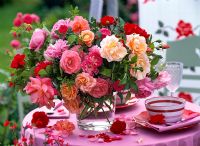 Floral display of mixed roses on tabletop