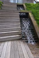 Stepped waterfall with timber steps and decking 