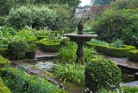 The Knot Garden with fountain and pool as the centrepiece - Dalemain Historic House and Gardens, Cumbria