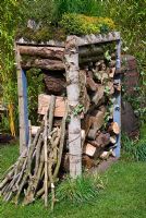 Beehive tower with undercover woodstore and green roof - Eats Shoots and Leaves Garden, RHS Cardiff Flower Show 2009