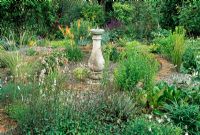 The sundial garden with Kniphofia thompson var thompsonii, Dierama, Dactylorhiz x braunii and others