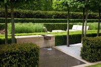 Water feature, clipped hedges and Calamagrostis x acutiflora 'Karl Foerster' - The Laurent-Perrier Garden, Sponsored by Champagne Laurent-Perrier - Gold medal winner at RHS Chelsea Flower Show 2009