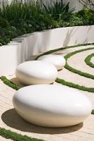 White pebble seats in The Cancer Research UK Garden, sponsored by Cancer Research - Silver-Gilt Flora medal winner at RHS Chelsea Flower Show 2009

