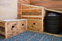 A seat with storage areas and a compost bin created from car tyres with gravel and timber path in the Marshalls Living Street Garden, sponsored by Marshalls plc - Silver-Gilt Flora medal winner at RHS Chelsea Flower Show 2009
