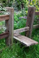 A wooden stile leads into The Fenland Alchemist Garden, sponsored by Giles Landscapes - Gold medal winner for Best Courtyard Garden at RHS Chelsea Flower Show 2009 