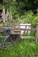 Old bicycle by fence with beehive and cottage garden flowers - The Fenland Alchemist Garden, sponsored by Giles Landscapes - Gold medal winner for Best Courtyard Garden at RHS Chelsea Flower Show 2009 