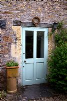 Old door decorated with wreaths - The Old Malthouse