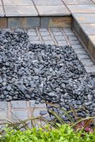 Black pebbles set in tiled paving - An Urban Retreat by Paul Titcombe - BBC Gardeners' World Live 2009 - Gold Medallist 
