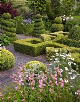 Knot Garden with various shaped box shrubs and hedges, brick pathways and herbaceous perennials - Woodpeckers, Warwickshire