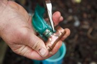 Garden watering system - Step 5 - Use a pair of pliers to pull or push the hose onto the copper fitting