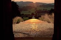 View due West at sunset down The Cascade from within Cascade House - Chatsworth House, Derbyshire 