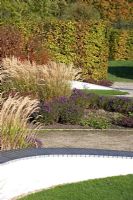 Section of Brita von Schoenaich's design of the Walled Garden at Marks Hall in Essex.  Plants include Calamagrostis x acutiflora 'Karl Foerster', Aster, Berberis and deciduous hedge