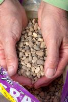 Gravel being held in cupped hands