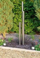 Stainless steel water feature by The Stage Llanllyr Garden, Talsan, Ceredigion, Wales, June
