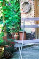 View through Garden Chair to Courtyard Garden beyond in Summer