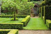 Buxus - Box and Taxus baccata - Yew topiary hedging and buttresses with quartered lawn. The 'Little Garden', Henbury Hall, Cheshire