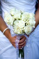 Woman holding a posy wedding of flowers