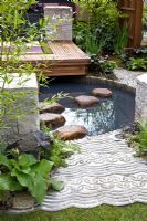 Small pond in modern garden - A Japanese Tranquil Retreat Garden, sponsored by Sekisui Exterior Co Ltd - Silver-Gilt Flora medal winner at RHS Chelsea Flower Show 2009 