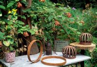 Found objects decorate a table in the garden, Raspberries add to the vintage atmosphere