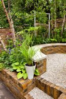 Small garden with raised brick flowerbeds