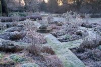 Formal rose garden with winter frost