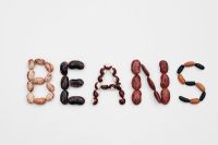 The most decorative seeds used to spell BEANS. Italian firetongue Bean 'Borlotto', Runner Bean 'Scarlet Emperor', Yin and Yang or Pea Bean, Runner Bean 'Celebration' and Dwarf Beans 'Purple Teepee' (brown) with 'Dual' (black)