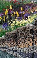 Gabion retaining wall for perennial planting on a slope - RHS Tatton Park Flower Show