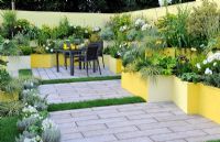 Patio garden with extensive planting in raised beds - RHS Tatton Park Flower show 