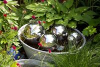 Water features in metal tubs with floating metallic balls