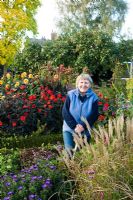 Joan Curtis working in her garden