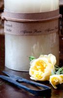 Yellow roses, shears and scented candle
